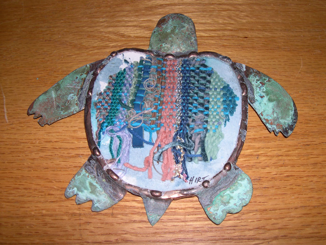 weaving under glass turtle
